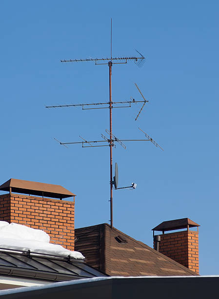 Antenna on the roof Antenna on the roof in sunny midday against bleu sky parabol stock pictures, royalty-free photos & images