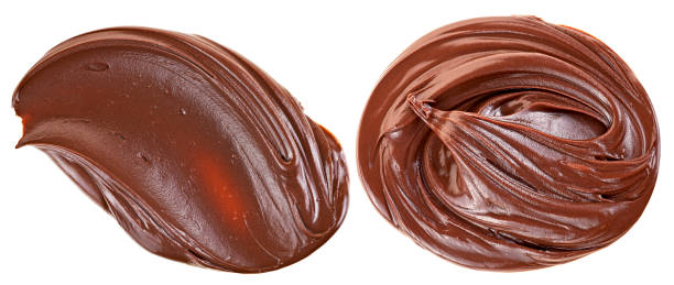 istock Hazelnut cream swirls isolated on a white background, top view. Cream chocolate spreading. 1754717764