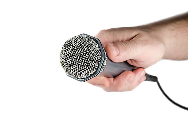 istock Male hand holding microphone. 175471806