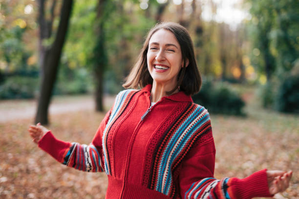 Beautiful woman in nature. Autumn is coming. Warm clothing.
