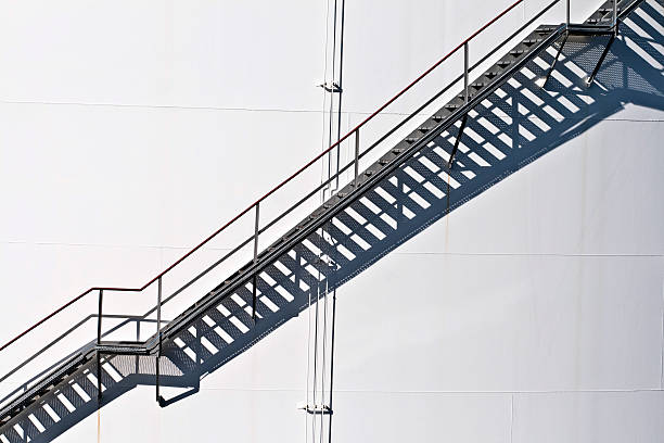 istock white tanks in tank farm with staircase 175473982