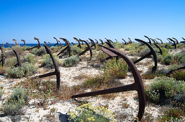 istock Anchor cemetery against blue sky 175474102