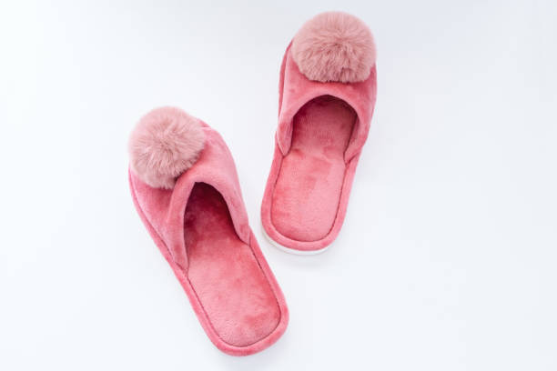 istock Cute home pink fluffy slippers on white background 1754745100
