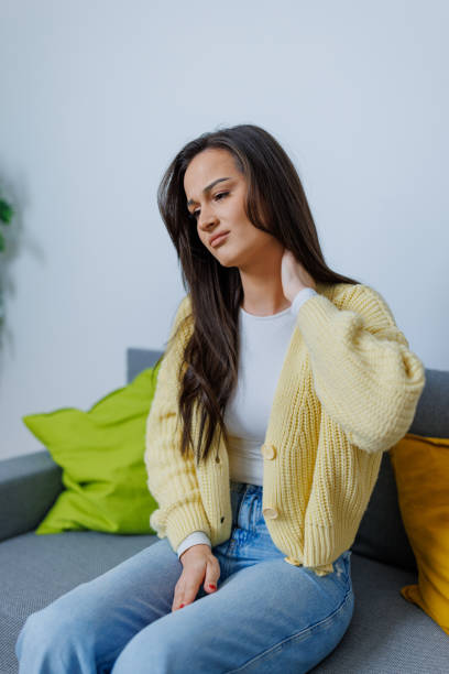 istock Young woman suffering from neck pain 1754747806