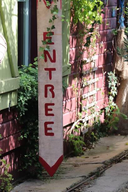 istock there is a long pole with signs on it in front of a house 1754754480