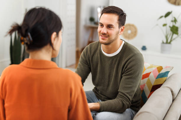 istock Girlfriend and boyfriend bonding on a sofa at home 1754755555