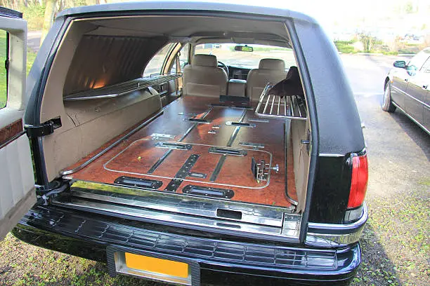 Interior of a funeral car or hearse: flower racks on the sides to transport the sympathy flowers with the coffin