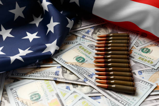 istock American flag, dollars, bullets, cartridges, ammunition. 1754761637