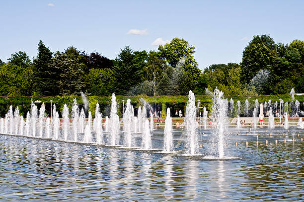 Columns od fountains in public place stock photo