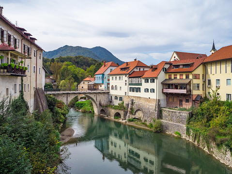 City of Skofja Loka, Slovenia with view of the Capuchin Bridge over the Selska Sora River in the old city center