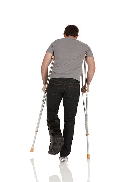 istock Injured man walking with the help of crutches 175479410