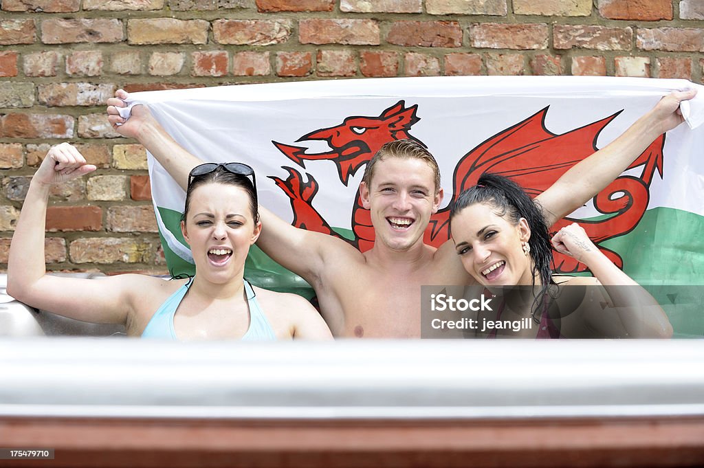 Happy Wales supporters in hot tub Happy Wales supporters in hot tubMore like this 20-29 Years Stock Photo