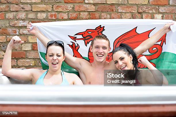 Happy Wales Supporters In Hot Tub Stock Photo - Download Image Now - 20-29 Years, Adult, Adults Only