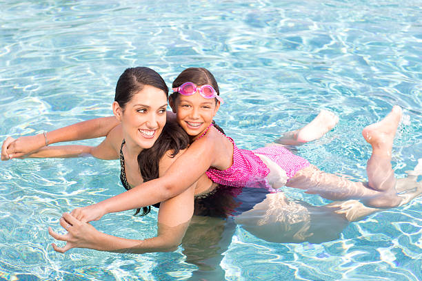 istock Mother and Daughter in Pool 175480025