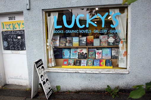 Vancouver, Canada – June 18, 2023: A well-stocked book store featuring an eye-catching window display of books and comics