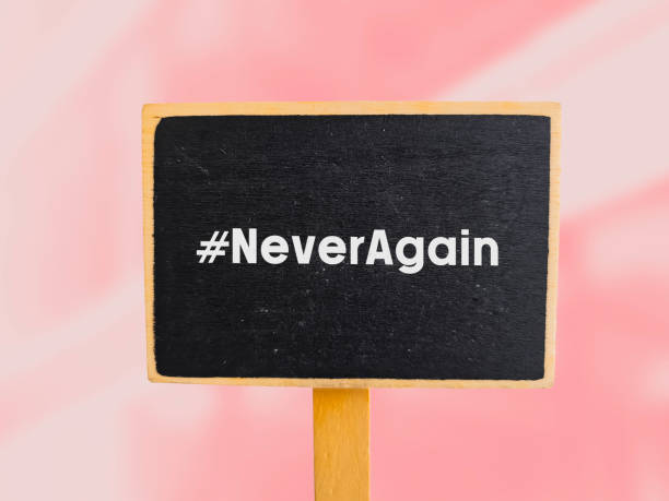 istock the hashtag Never again written on chalk board to strict gun control laws after mass shootings in the United States. 1754803543