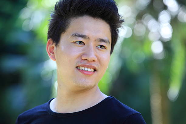 istock Young Asian man smiling outdoors 175481211