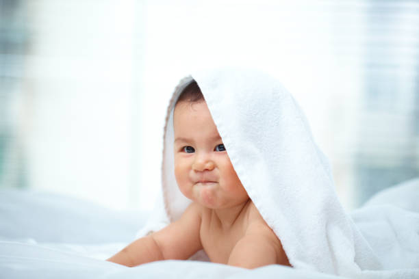 istock lovely baby boy in bed 175481332