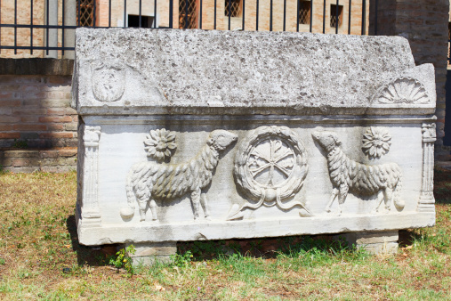 Old, worn out and illegible tombstone in St. Matthews cemetery in Quebec city during springtime day