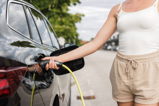 istock Girl charging an electric car 1754815125