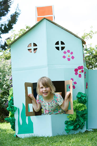 istock Two Children Playing In Home Made Cardboard House 175482825