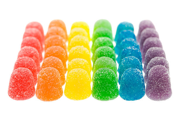 Rainbow Colored Candy Rainbow Colored gum drop candy against a white background gum drop photos stock pictures, royalty-free photos & images