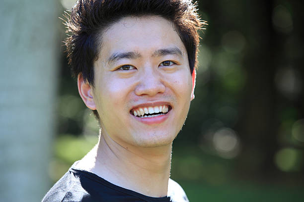 istock Young Asian man smiling outdoors 175483186