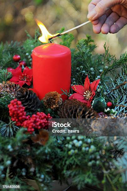 Fire On Advent Wreath With Red Candle And Ornaments Stock Photo - Download Image Now