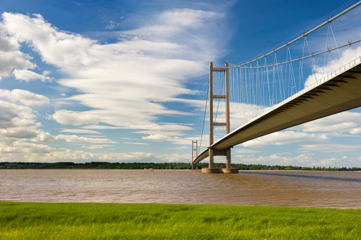 The Humber Bridge was once the longest single span suspension bridge in the world. Seen here from the Lincolnshire banks of the River Humber.