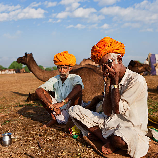 istock Indian men smoking the pipe during festival in Pushkar 175483840