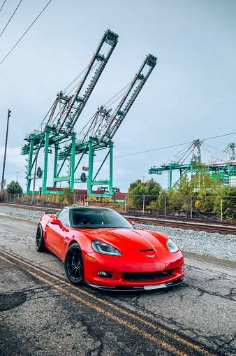 Seattle, WA, USA\nOctober 24, 2023\nRed Corvette Z06 showing the car with a crane in the background