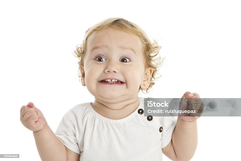 Adorable expressive little girl Sweet little girl grimacing at camera Ecstatic Stock Photo