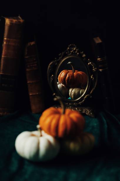 istock pumpkin on the old books rustic halloween style 1754847165