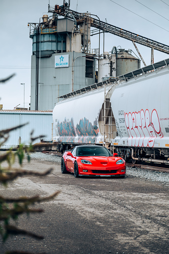 Seattle, WA, USA
October 24, 2023
Red Corvette Z06 showing the car next to a train