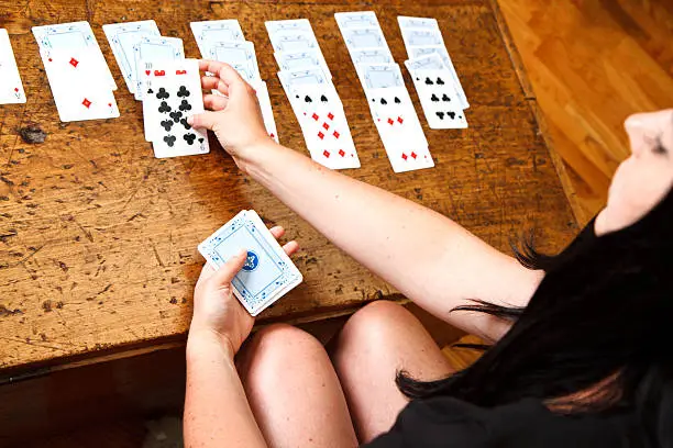 Hands Playing Solitaire Card Game 