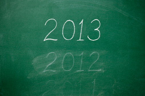 Deleting 2012 written on the blackboard with 2013