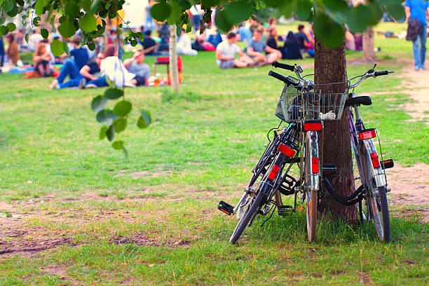 A bicycle near the bench in green park on sunny day