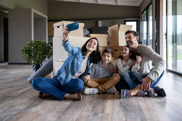 istock Family taking a selfie while looking happy moving house 1754873213