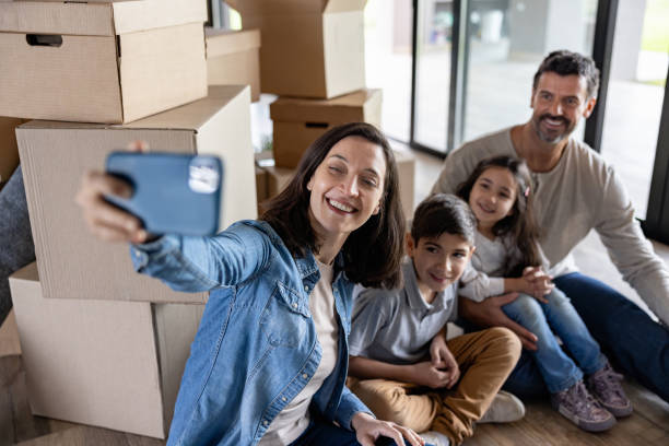 istock Happy family taking a selfie while moving house 1754873227