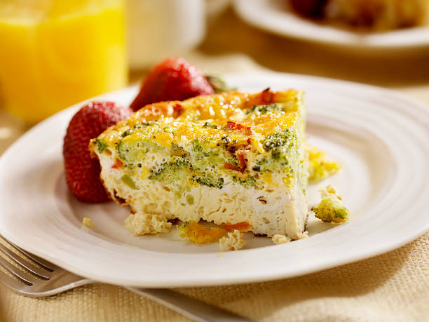 Cheese and Broccoli Frittata "Cheese and Broccoli Frittata with Roasted Red Peppers, Coffee, Orange Juice and Fresh Strawberries - Photographed on Hasselblad H3D2-39mb Camera" frittata stock pictures, royalty-free photos & images