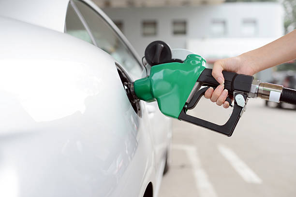 Refueling At Gas Station - XXXXXLarge Refueling At Gas Station oil pump photos stock pictures, royalty-free photos & images