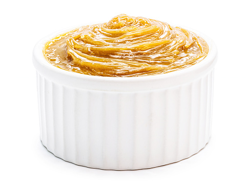 Brazilian dulce de leche, type of milk cream and pasty caramel, isolated white background