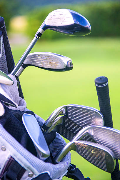 istock golfclubs golfbag on driving-range fairway 175488387
