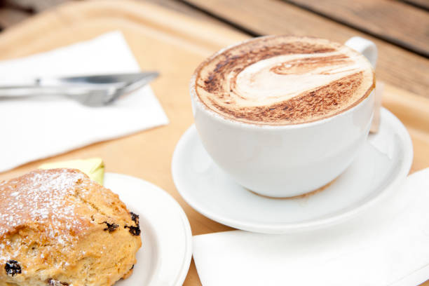 Capuccino and scone stock photo