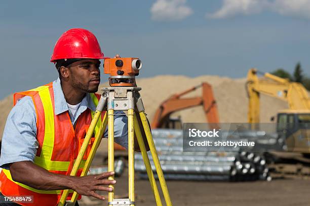 Surveyor At Site Stock Photo - Download Image Now - Surveyor, African Ethnicity, Theodolite