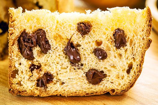 homemade panettone slice, with candied fruit, typical Christmas bread made in Brazil and Italy, traditional Christmas dessert