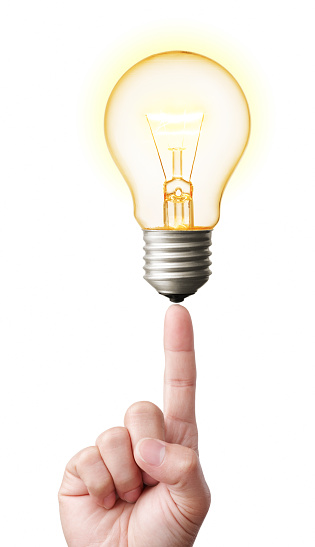 finger pointing at glowing lightbulb, idea symbol