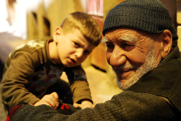 Grandfather is playing with grandson