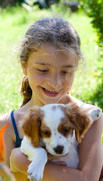 istock Little Girl with Her Dog 175488828