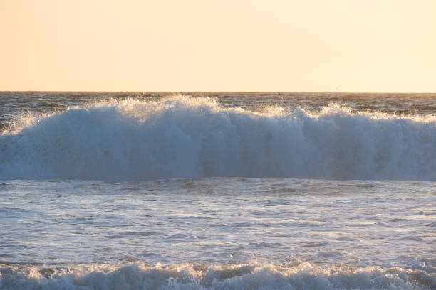 Southern California, USA - Pacific Ocean waves breaking onto a beach in Southern California